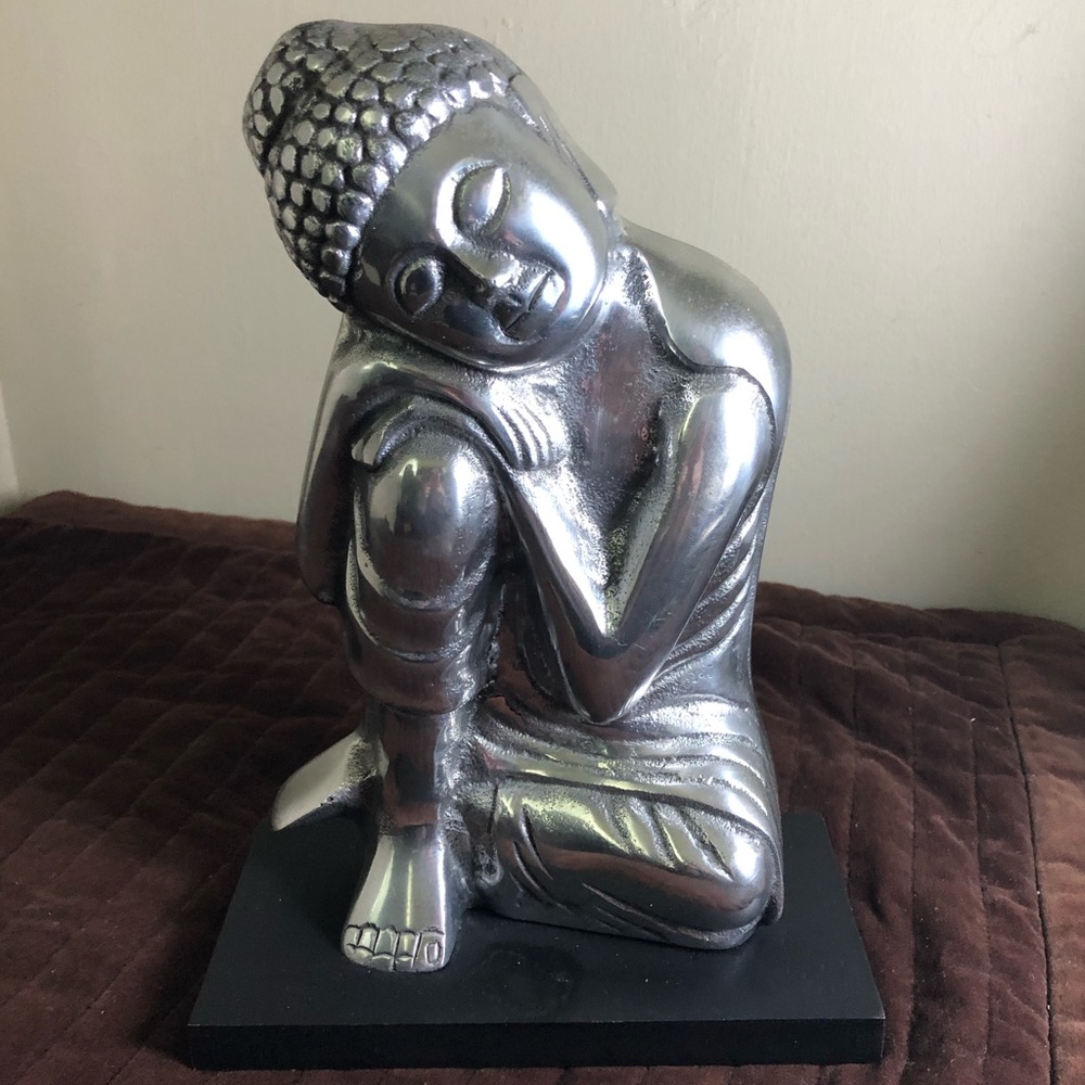 Buddha on stand.